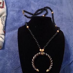 Black and white shoe horn and bead long necklace